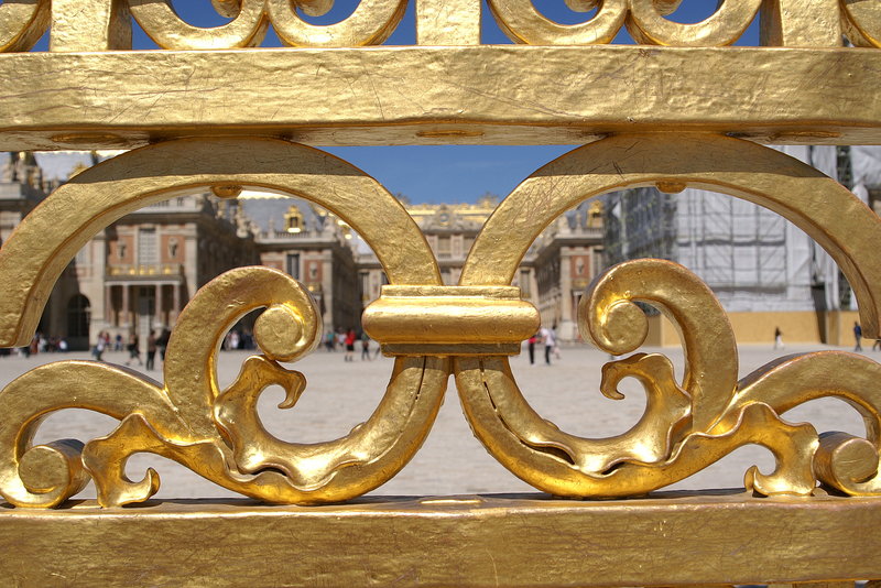 Peeking through gate at Versailles in Paris
